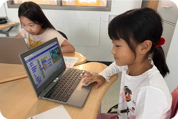 Girl coding in Python for Boolean Girl Summer Camp